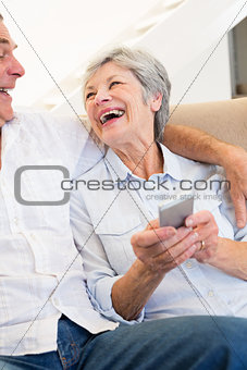 Senior couple with smartphone