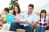 Family opening Christmas gifts