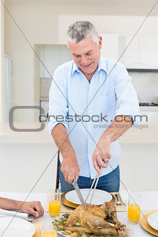 Senior man serving food