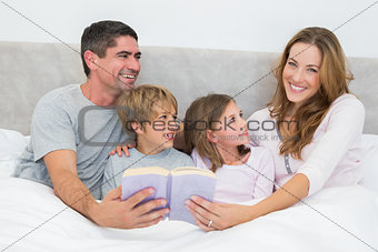 Happy woman holding storybook