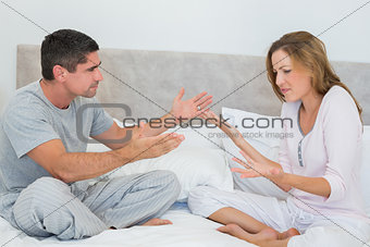 Frustrated couple in bedroom
