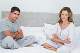 Unhappy couple in bed