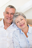 Affectionate senior couple smiling together