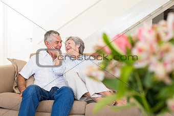 Loving senior couple on sofa