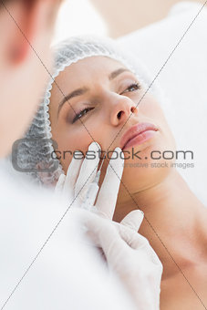 Woman recieving botox injection in upper lip