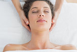 Woman receiving massage in health spa