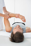 Man receiving hand massage at spa