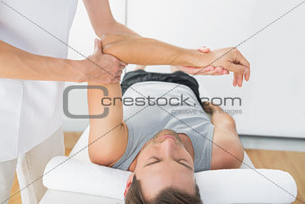 Man receiving hand massage at spa