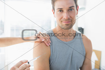 Man being injected by doctor