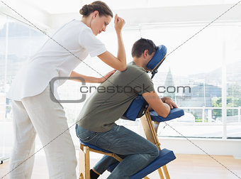 Man receiving massage from physiotherapist