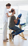Therapist massaging man in hospital