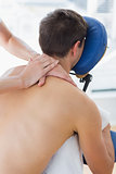 Man being massaged by therapist