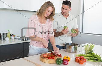 Couple preparing food in kitchen