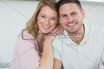 Couple smiling in kitchen