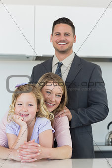 Family smiling together at table