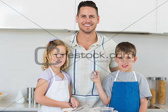 Family in aprons baking cookies