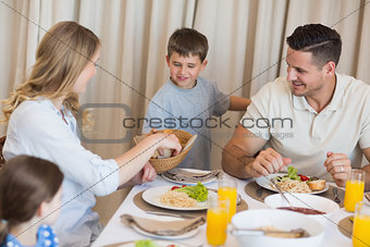 Family eating lunch at dining table
