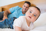 Baby with father in bed