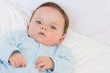 Portrait of adorable baby in bed