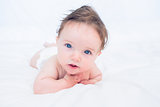 Baby with blue eyes looking away