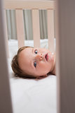 Portrait of baby in crib