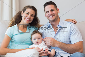 Smiling parents with baby boy