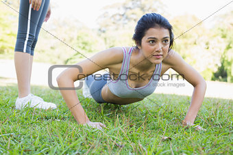 Dedicated woman doing push ups