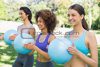 Sporty women exercising with medicine balls