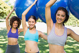 Sporty women exercising with fitness balls