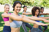 Fit women stretching in park