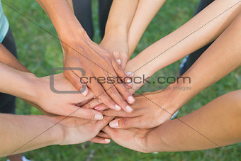 Hands stacked upon one another