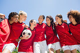 Female soccer team against clear sky