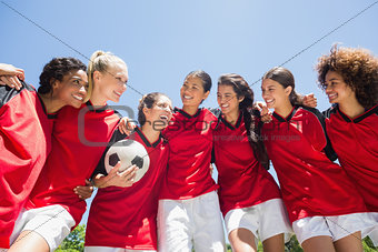 Female soccer team against clear sky