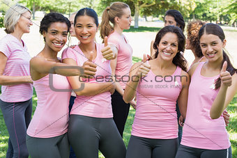 Breast cancer participants gesturing thumbs up