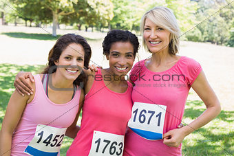 Happy women participating in breast cancer marathon