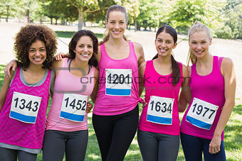 Confident women participating in breast cancer marathon