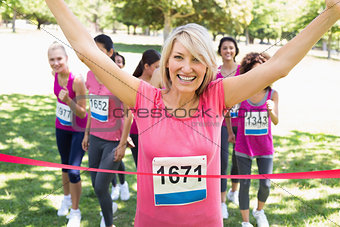 Happy winner of breast cancer marathon race