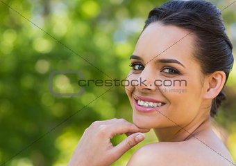 Close-up portrait of beautiful woman in park