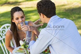 Couple drinking champagne at outdoor café