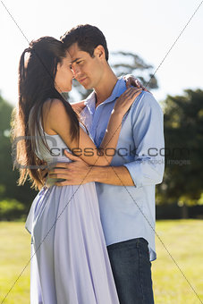 Loving couple embracing each other in park