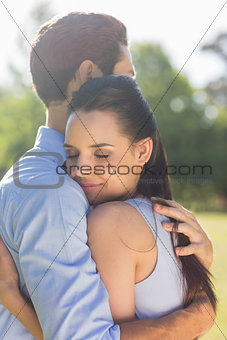 Young couple embracing at park