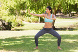 Healthy woman standing in fighting stance at park