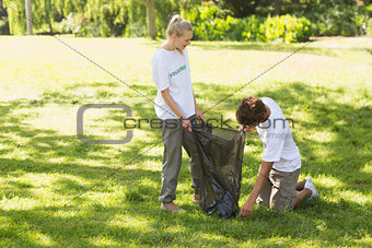 Volunteers picking up litter in park