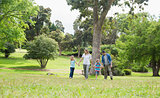 Parents and kids walking in park