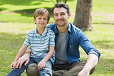 Portrait of a father and boy at park