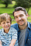 Close-up portrait of father and boy at park