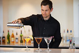 Bartender pouring cocktails