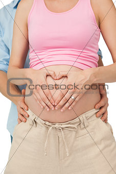 Expectant parents hugging