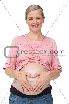 Happy pregnant woman with her hands on her belly