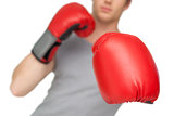 Athletic man wearing red boxing gloves
